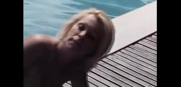  Blonde slut Dolly Golden sucks on a lucky man&039;s cock outside by the pool